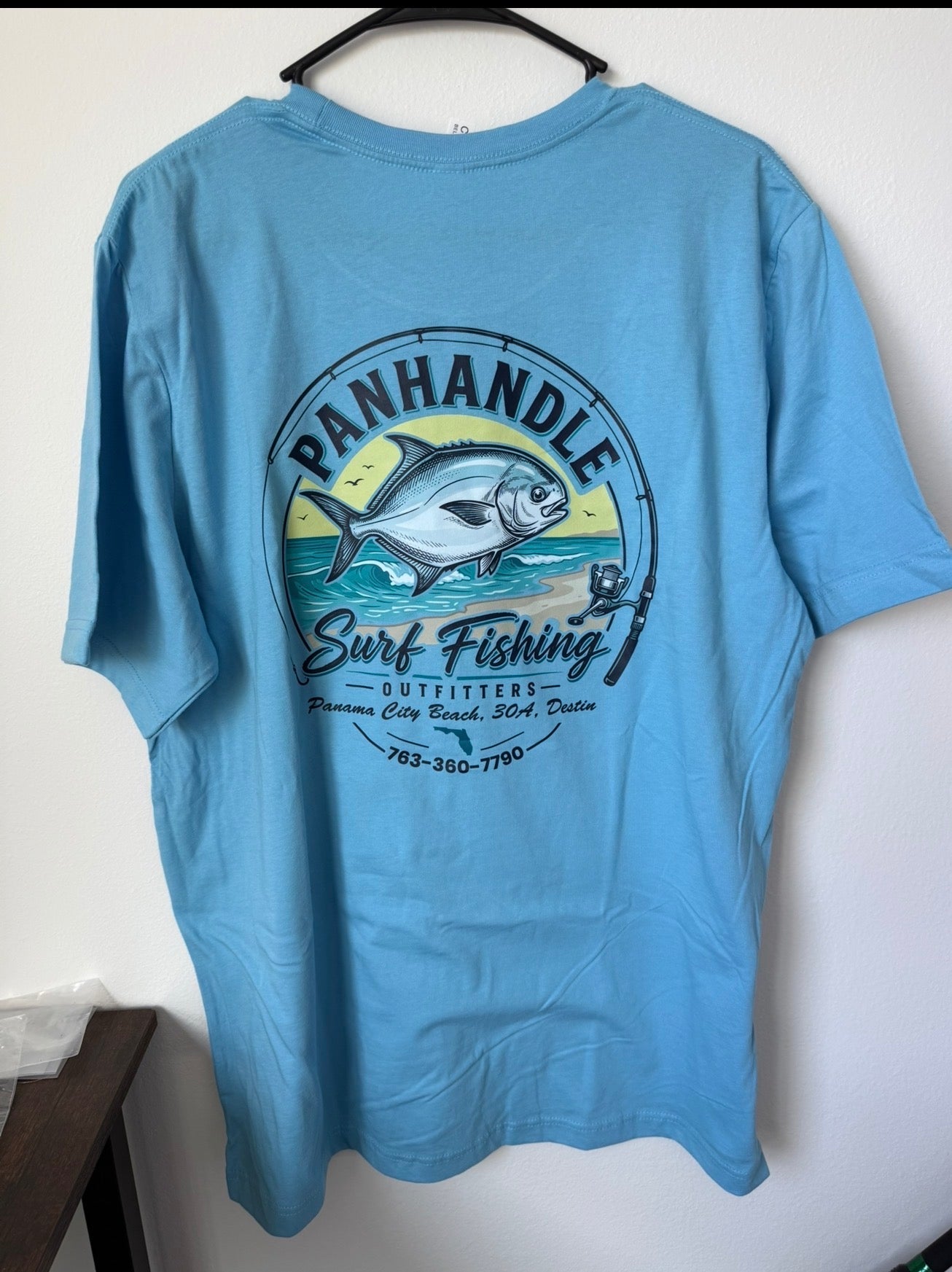Panhandle Surf Fishing Outfitters light blue t-shirt with surf fishing graphic